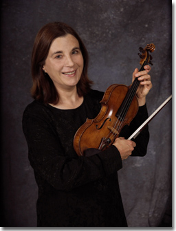 Professor Natalie Filipovich holds a violin.