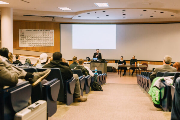 People attend a lecture in a lecture hall on WSU campus.