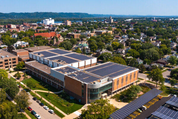 An aerial view of the solar panels on the roof of Memorial Hall and the Integrated Wellness Center on the WSU campus in Winona.