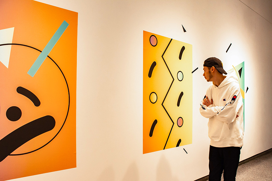WSU student looking at wall art