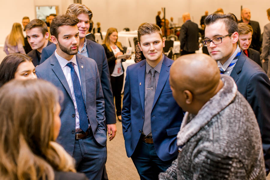 WSU business students speaking with an industry professional