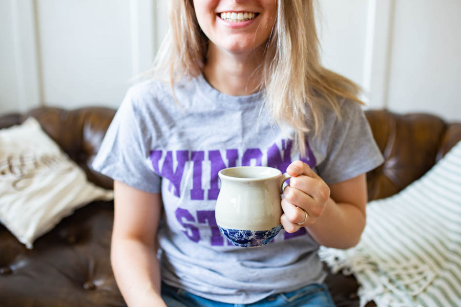 WSU student holding a coffee mug