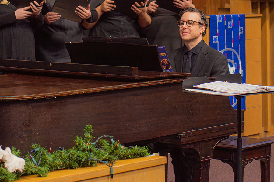 Music faculty Eric Brisson playing the piano