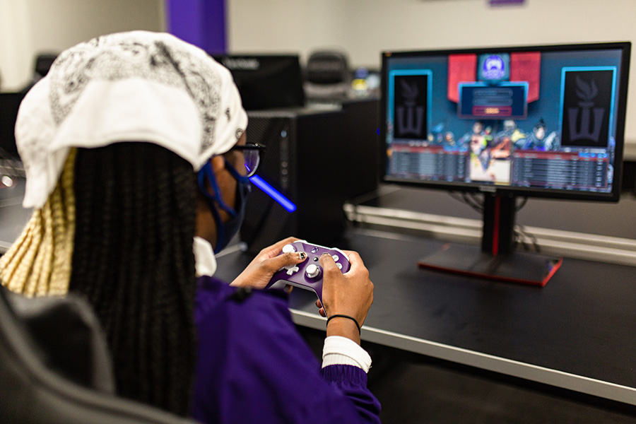 WSU student playing a video game in the Esports Lounge.