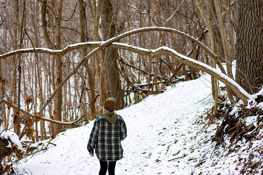 WSU student walking outside in the snow.