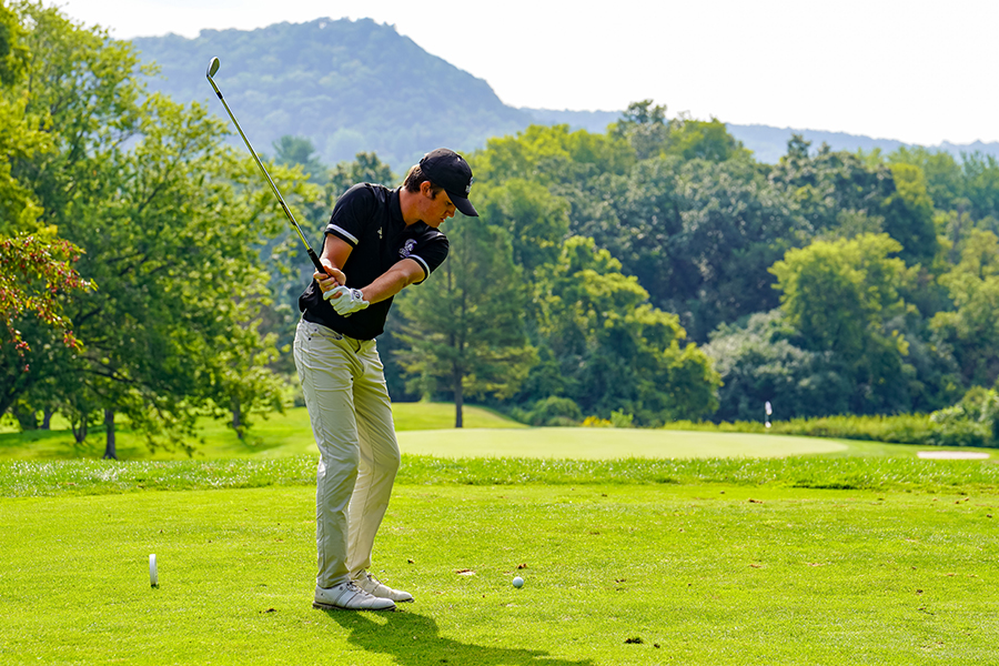WSU men's golf athlete on a golf course.