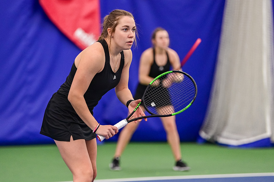 WSU women's tennis athlete holding a racket.