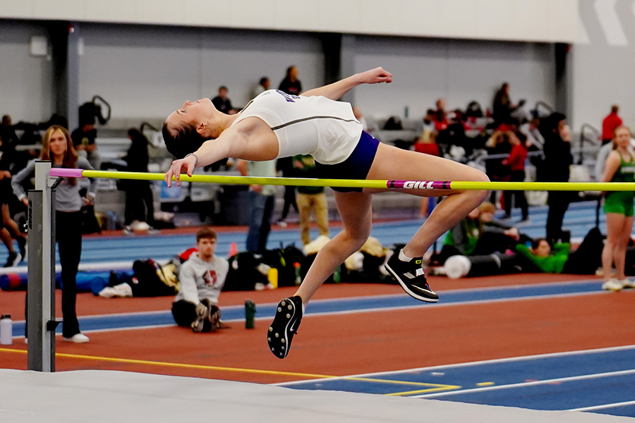 WSU women's track and field athlete competing at a meet.
