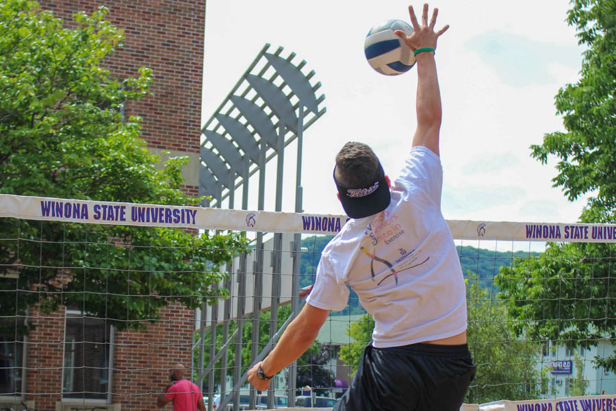 WSU student playing sand volleyball.