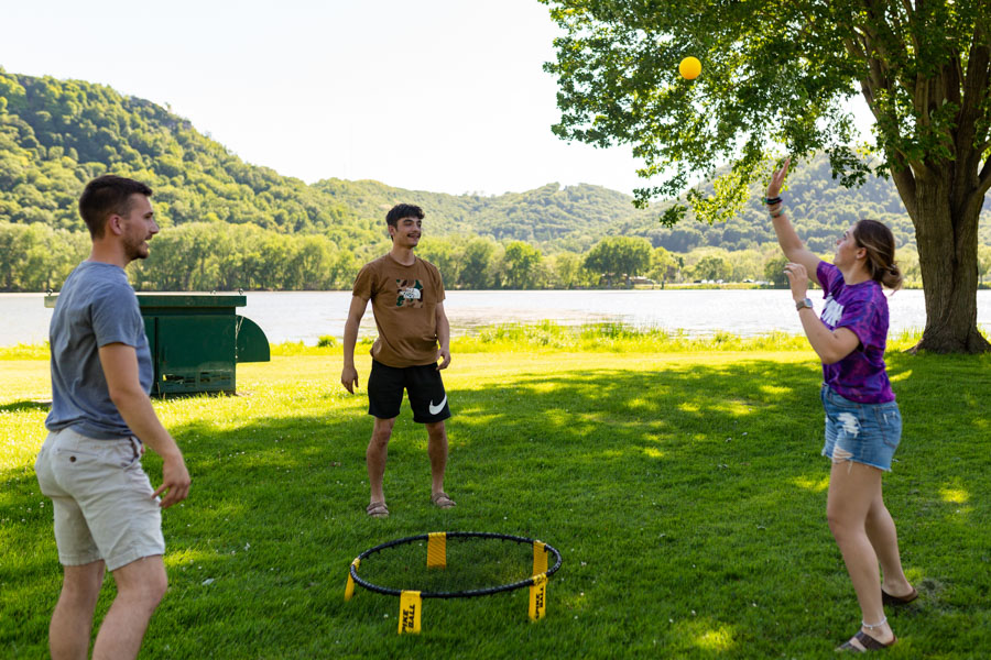 WSU-Students-Spikeball-Lake-2021-06-04 WSU students play spikeball by the lake.,