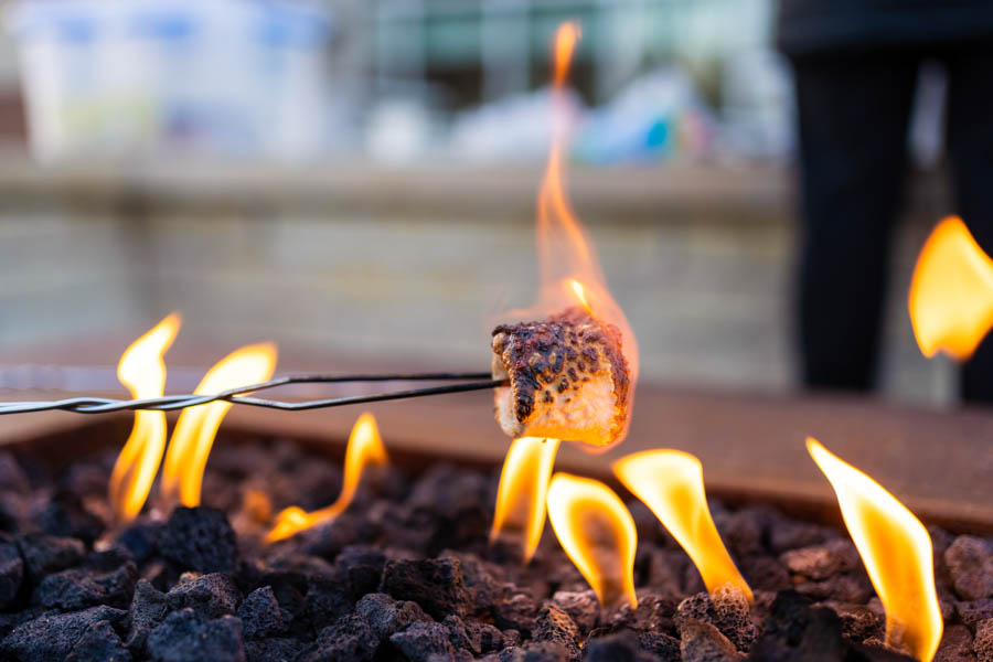 Close-up of a marshmallow being roasted at the Fire Feature Patio.