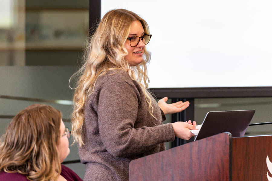 WSU student speaking at a podium