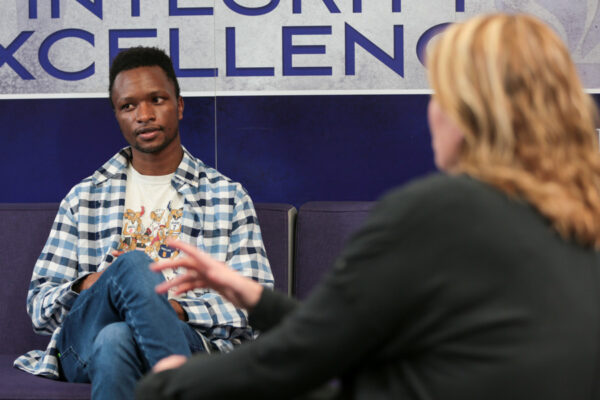 Students talking on a couch