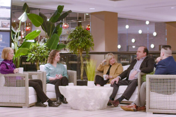 A group of professionals have a meeting in lounge at WSU-Rochester.