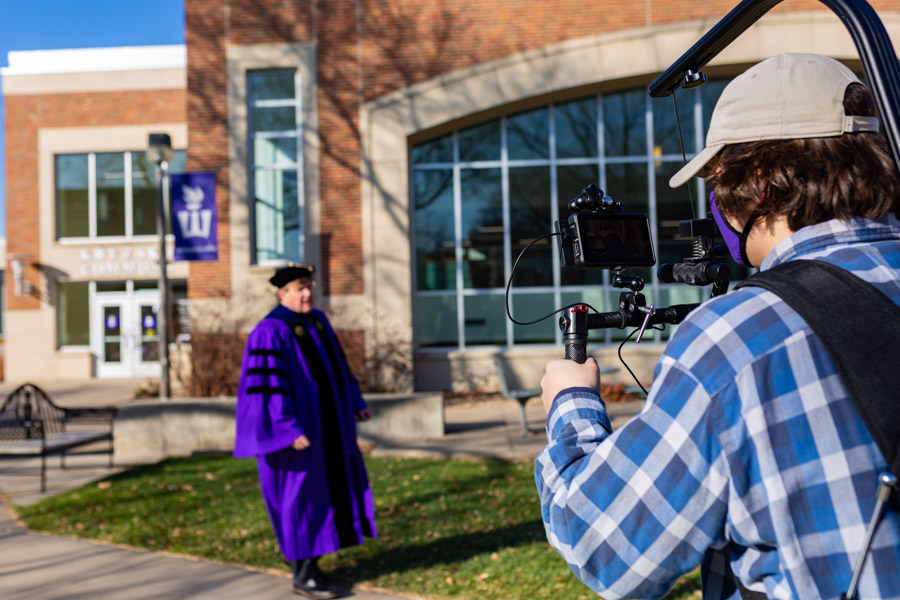 WSU videographer filming a staff member on campus.