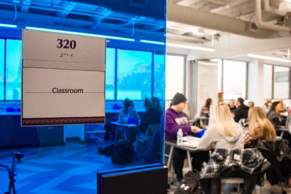 Groups of students attend class in a classroom at WSU Education Village.