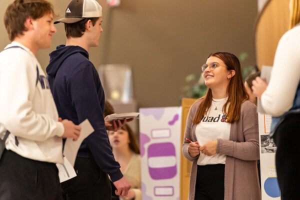 Students have a conversation at an event on the WSU campus.