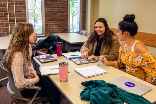 Students discuss topics during class on the WSU campus.