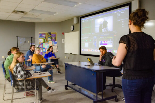A student gives a presentation during class on the WSU campus.