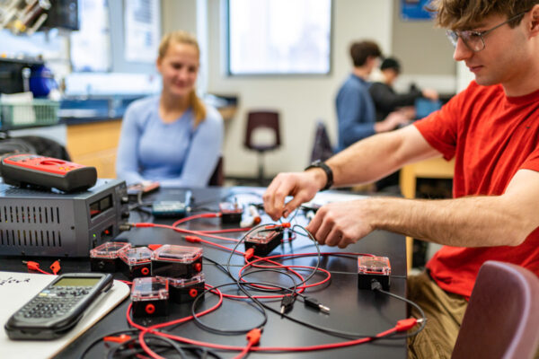 A student works on an electronics project during a lab class.