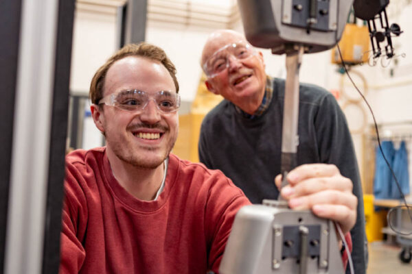 Anders Nielsen '24 with his grandfather in a Composite Materials Engineering lab.