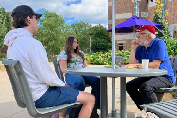 WSU professor John Campbell meeting with students on campus