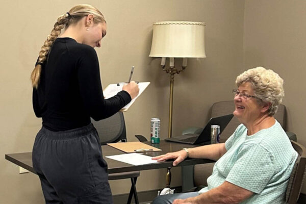 WSU Nursing students helping Holmen community members