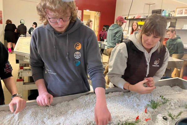Students participating in a lab activity at a STEM event