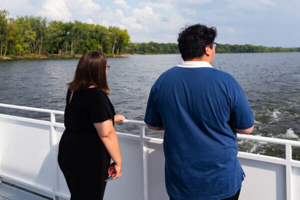 WSU students riding the Cal Fremling boat and looking at the water