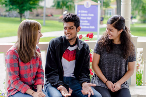 Three WSU student chat on the Winona campus.