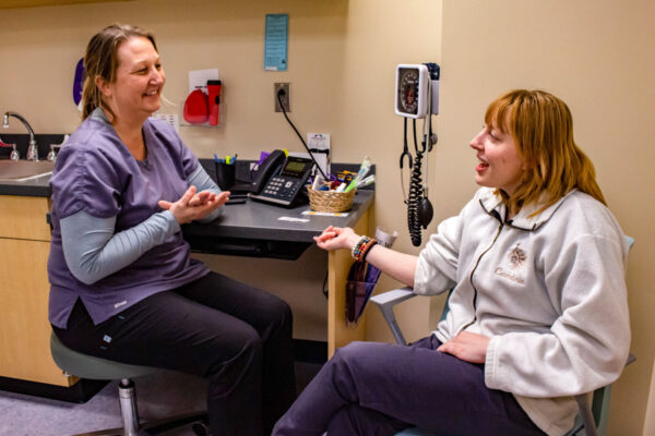 A student talks to a healthcare provider in the Health Services office on WSU campus.