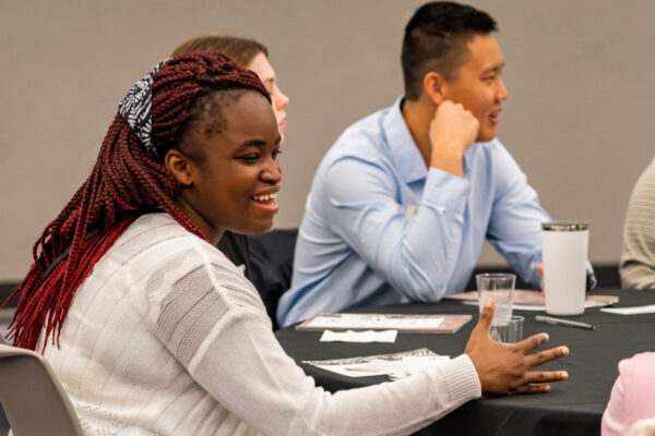 Students have a lively discussion in a classroom on WSU campus.