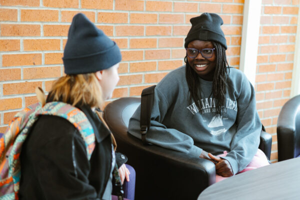 Two students chat on WSU campus.