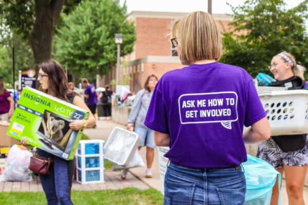 A student wearing a t-shirt that reads 