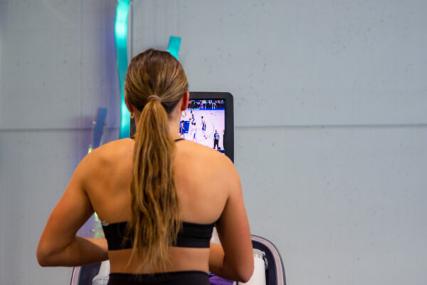 A female student runs on a treadmill in the WSU Fitness Center.