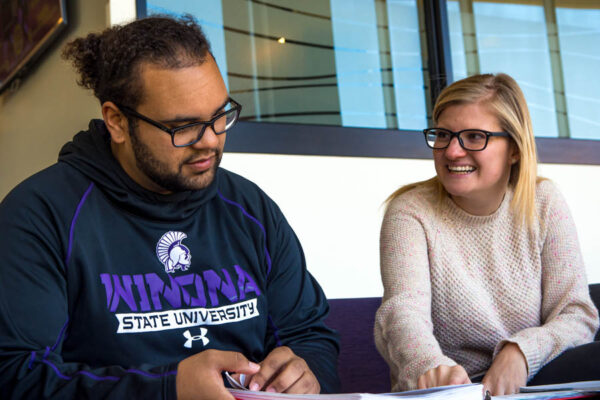 Two students work together in a lounge on the WSU campus.