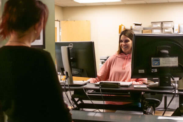 A person check in a the front desk of the Counseling Services office on the WSU campus in Winona.