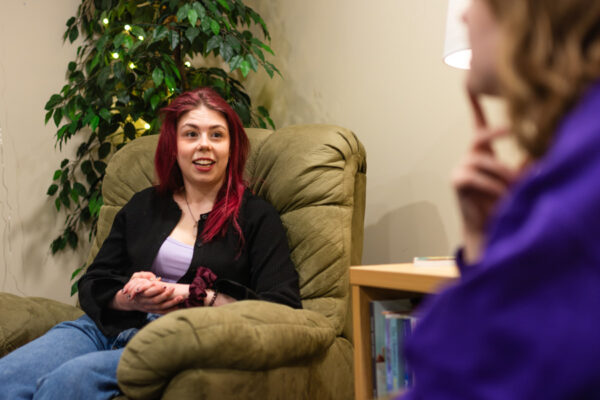 Two students have a conversation in the Relaxation Rooms on the WSU campus in Winona.