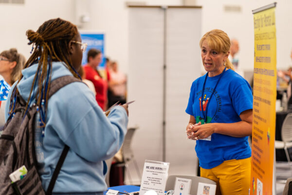 A student speaks to an employer during the WSU Career Fair.