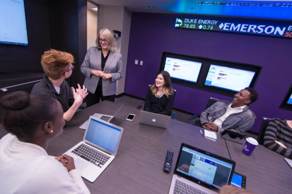 A professor leads class in the WSU Sales Center.