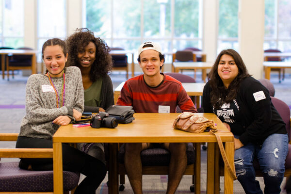 Students pose together for an event in the Baldwin Lounge on WSU campus.