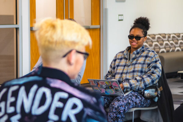 Studetns have a conversation in a WSU classroom.