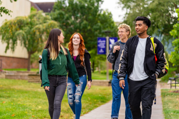 A group of students walk across the WSU campus.