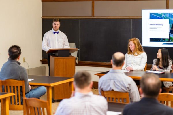 A student gives a presentation to a class.