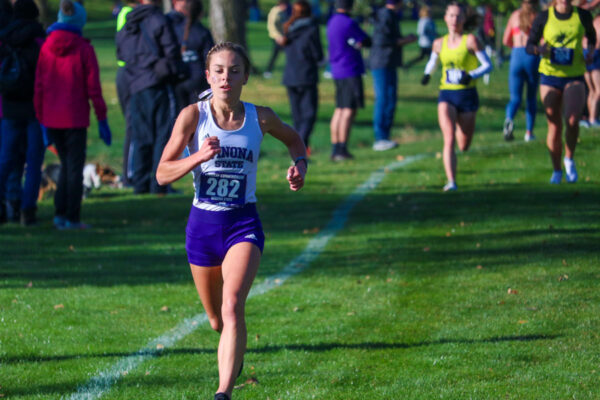 A WSU athlete runs down the trail during a cross country meet.