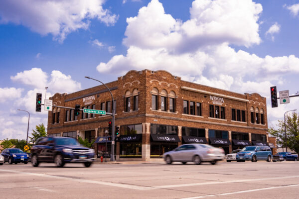 Cars drive past the WSU-Rochester Broadway location.