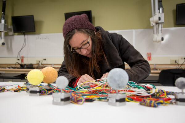 A student works on an an electronics project in a lab on the WSU campus.