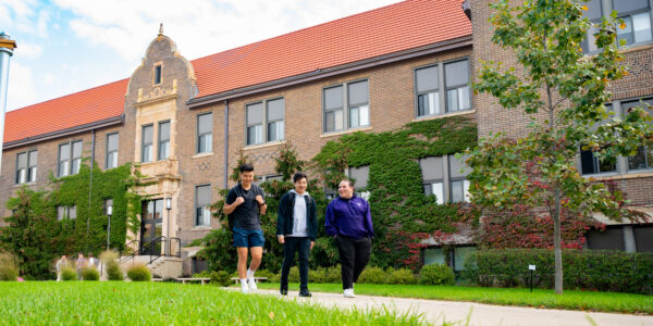 Students walk past Phelps Hall on the WSU campus in Winona, MN.