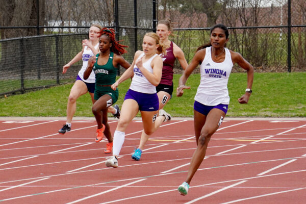 WSU athletes sprint down a track at a local sports facility.