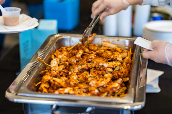 A chafing dish of chicken kabobs is set out for a catered meal on the WSU campus.